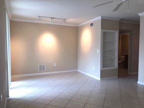West Palm Beach condo for rent - A room with a ceiling fan and a light switch.