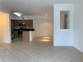West Palm Beach condo for rent - A kitchen area with a microwave and a countertop.