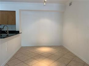 West Palm Beach condo for rent - A kitchen with a counter and cabinets.