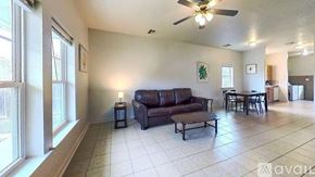 San Marcos house for rent - A long hallway with a door on the left and a window on the right.