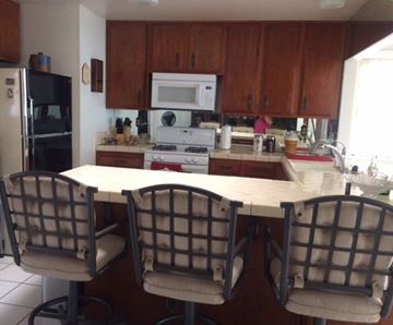 Palmdale apartment for rent - A kitchen with a table and chairs.
