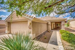Marana house for rent - A house with a garage door that says "RESERVED" is shown.