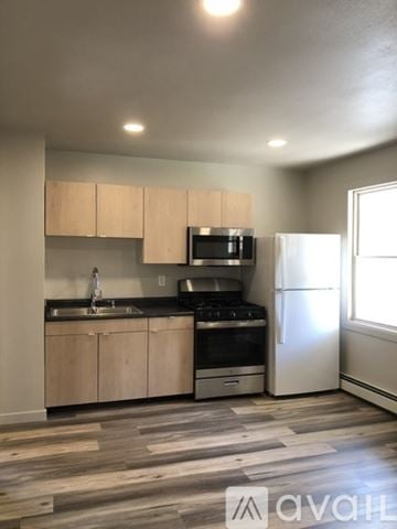 Willmar apartment for rent - A kitchen with a stove, sink, and refrigerator.