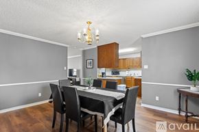 Sherwood house for rent - A dining room with a table set for four.