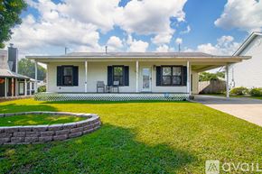 Sherwood house for rent - A house with a white exterior and black shutters is for sale.