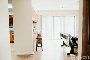 Sherwood house for rent - A kitchen with a dining table and chairs is visible through a doorway.