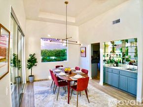 La Quinta house for rent - A dining room with a table set for six with a view of a backyard.