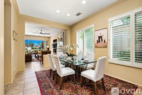 La Quinta house for rent - A dining room with a glass table and chairs.