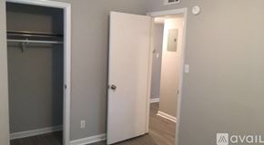 Hinesville apartment for rent - A white door is open to a hallway.