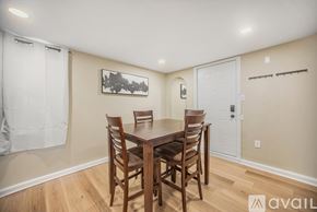 Grand Rapids house for rent - A dining room with a wooden table and chairs.