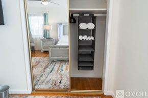 Fullerton house for rent - A bedroom with a large mirror and a built-in shelf.