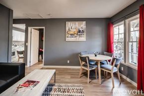 Los Angeles house for rent - A dining room with a table set for four and a couch.