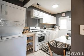 Los Angeles house for rent - A kitchen with a white oven and a white fridge.