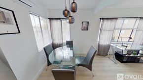 North Hollywood apartment for rent - A modern dining room with a glass table and chairs.