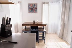 Los Angeles apartment for rent - A dining room with a table and chairs.