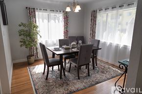 North Hollywood house for rent - A dining room with a table set for four and a potted plant.