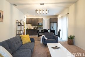 Los Angeles house for rent - A modern living room with a grey sofa and a white coffee table.