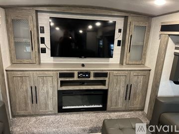 Key Largo apartment for rent - A modern living room with a television, a built-in oven, and a cabinet.