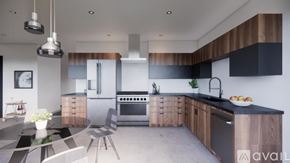 Winter Park condo for rent - A modern kitchen with a black countertop and wooden cabinets.