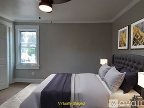 Monongahela house for rent - A bedroom with a bed, a window, and two pictures on the wall.