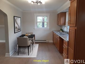 Monongahela house for rent - A kitchen with a table and chairs in the middle of the room.