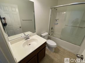 Hayward apartment for rent - A bathroom with a sink, toilet, and shower.