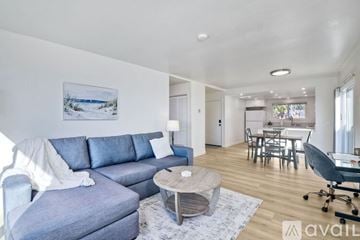 Carlsbad apartment for rent - A living room with a grey couch and a coffee table.