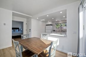 Carlsbad apartment for rent - A dining room with a wooden table and chairs.