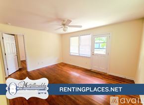 Augusta apartment for rent - A room with a ceiling fan and a window.