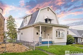Belle Vernon house for rent - A two-story house with a front porch and a garage door.