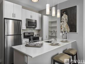 Chicago apartment for rent - A modern kitchen with a large island and stainless steel appliances.
