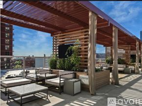 Chicago apartment for rent - A wooden patio with tables and chairs and a sign that says "CABANA".