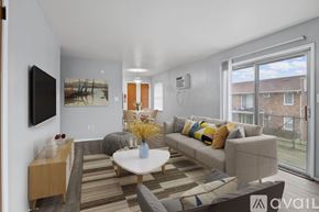 Elwood apartment for rent - A living room with a sofa, a coffee table, and a television.