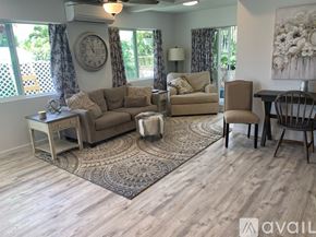 Kailua house for rent - A living room with a sofa, armchair, and coffee table.