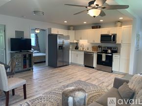 Kailua house for rent - A modern kitchen with a refrigerator, oven, and microwave.