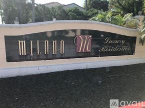 West Palm Beach condo for rent - A sign for Milan Residences is displayed on a wall.