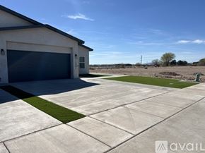 Socorro apartment for rent - A house with a garage and a driveway in front.