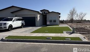 Socorro apartment for rent - A white SUV is parked in front of a two-story house with a garage.