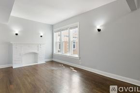 Chicago apartment for rent - A room with a fireplace and a window.