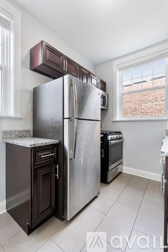 Chicago apartment for rent - A kitchen with a stainless steel refrigerator and oven.