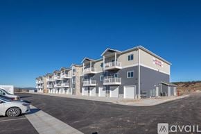 Piedmont apartment for rent - A row of modern townhouses with a car parked in front.