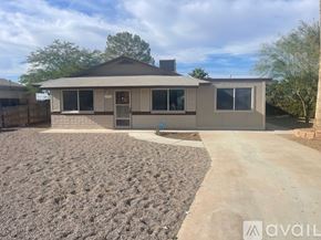Casa Grande house for rent - A house with a grey roof and a brown garage door is available for rent.