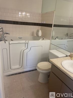 Casa Grande house for rent - A bathroom with a white toilet, sink, and bathtub.