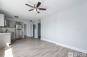 Chicago apartment for rent - A spacious kitchen with a fan on the ceiling.