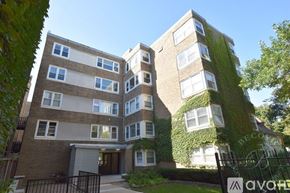 Chicago apartment for rent - A multi-story building with a green vine on the side.