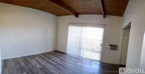 Thousand Oaks apartment for rent - A building with a balcony and a green lawn in front.