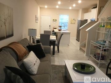 St. Augustine house for rent - A living room with a grey couch and a white coffee table.
