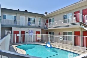 Hawthorne apartment for rent - A small pool is surrounded by a balcony with a railing.