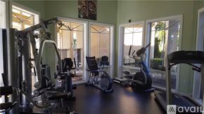 West Palm Beach condo for rent - A gym with a variety of equipment including a treadmill, weights, and a stationary bike.