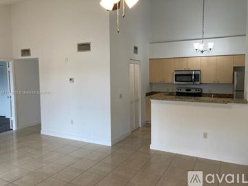 West Palm Beach condo for rent - A kitchen area with a counter and cabinets.